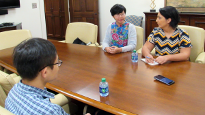 Chuntian Wang, Dang Nguyen and Mojdeh Rasoulzadeh sitting at a table.