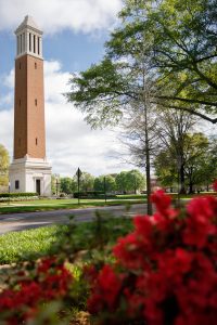 Denny Chimes with flowers in bloom in the foreground
